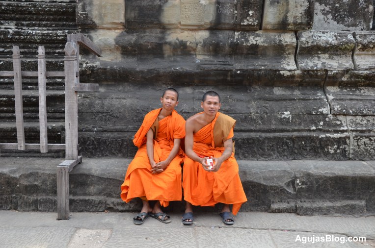 Monks care for the ancient temple. According to my husband, monks hold a place of honor. He saw people give up their seats for them at the front of busses and the people feed them every day.