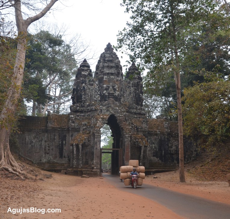 A basket wholesaler carries his wares to vendors in the city.