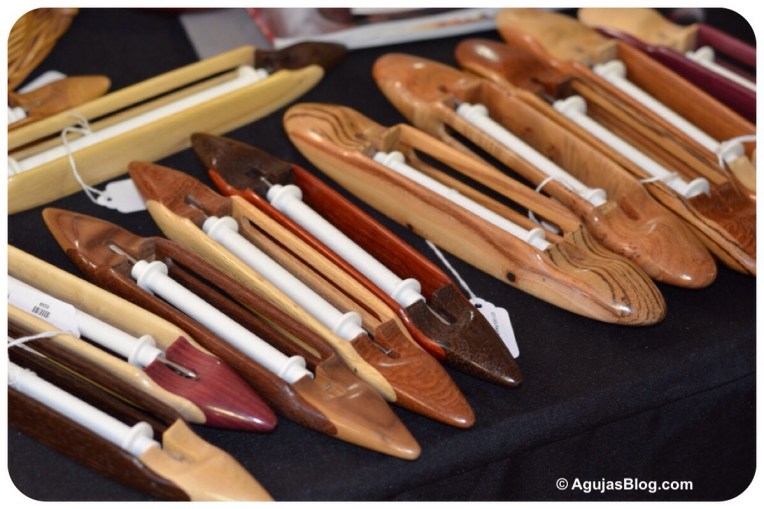 These wooden shuttles are from Yarnorama (I think). I didn't pick up a business card. (www.yarnorama.com)